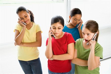 simsearch:400-05012508,k - Preteen girls of mutiple ethnicities talking on cell phones. Foto de stock - Super Valor sin royalties y Suscripción, Código: 400-03940879