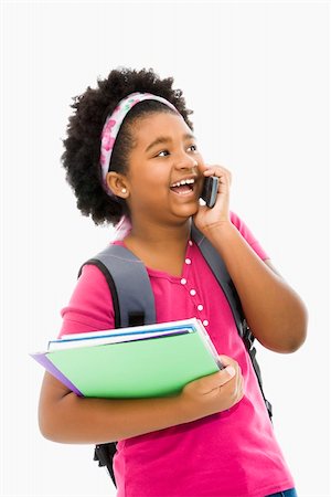simsearch:400-05012508,k - African American girl with books and wearing backpack talking on cell phone. Foto de stock - Super Valor sin royalties y Suscripción, Código: 400-03940966