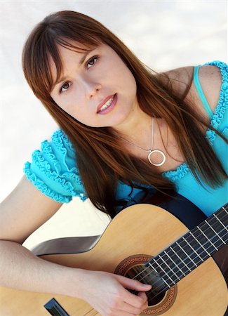 simsearch:400-04652753,k - Yong pretty woman playing the guitar Stock Photo - Budget Royalty-Free & Subscription, Code: 400-03941846