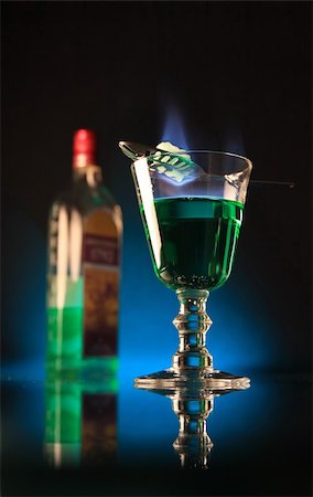 A glass of absinth with burning sugar upon. Stock Photo - Budget Royalty-Free & Subscription, Code: 400-03941880