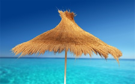 simsearch:400-04062726,k - Relaxing on Tropical Beach under umbrella on sunny day Foto de stock - Super Valor sin royalties y Suscripción, Código: 400-03942197
