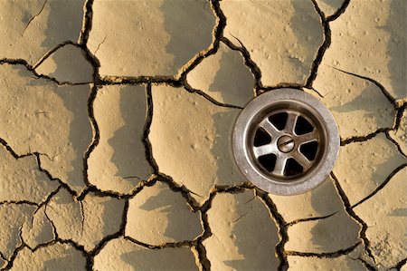 dusty environment - The missing piece of the drought puzzle - the sewer - nice raindrop craters on the pieces Stock Photo - Budget Royalty-Free & Subscription, Code: 400-03942427