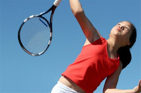 simsearch:640-06050635,k - Girl playing tennis against the sky Stock Photo - Budget Royalty-Free & Subscription, Code: 400-03942516