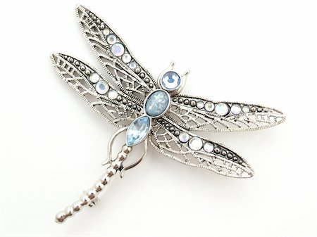 silver anniversary backgrounds - isolated dragonfly jewelry on white background Foto de stock - Super Valor sin royalties y Suscripción, Código: 400-03942567