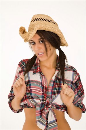 Very sexy Caucasian woman dresses as a cowgirl standing on white background Photographie de stock - Aubaine LD & Abonnement, Code: 400-03942737