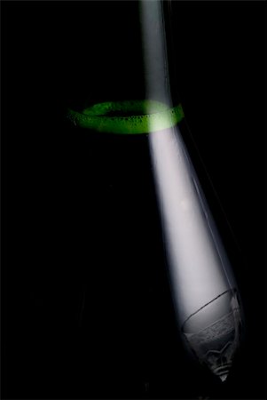 simsearch:400-07166551,k - Close up of a bottle of champagne with a glass reflected in her profile Stock Photo - Budget Royalty-Free & Subscription, Code: 400-03942813