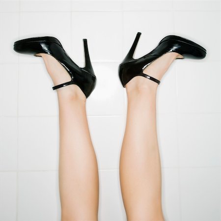 simsearch:400-04450069,k - Caucasian female legs sticking up in air with high heels turned out. Stock Photo - Budget Royalty-Free & Subscription, Code: 400-03943312
