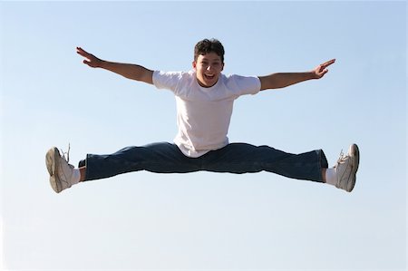 Boy making a split high in the air Stock Photo - Budget Royalty-Free & Subscription, Code: 400-03943607