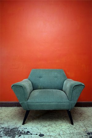 plaster (medical cast) - A well worn chair set against an orange wall in a room in Mexico. Stock Photo - Budget Royalty-Free & Subscription, Code: 400-03943794