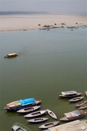 Boats on the Ganges river next to the gaats in Varanasi, India Stock Photo - Budget Royalty-Free & Subscription, Code: 400-03943854