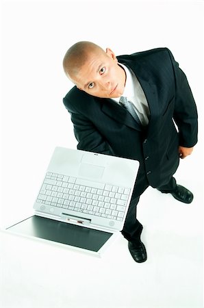 simsearch:400-03954954,k - A young businessman with a blue tie and white shirt with laptop computer Stock Photo - Budget Royalty-Free & Subscription, Code: 400-03954936