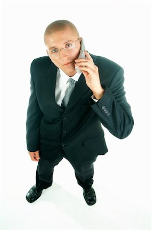 simsearch:400-03954954,k - A young businessman with a blue tie and white shirt with cell phone Stock Photo - Budget Royalty-Free & Subscription, Code: 400-03954938