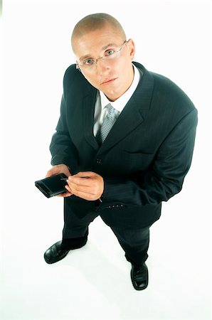 simsearch:400-03954954,k - A young businessman with a blue tie and white shirt with PDA Stock Photo - Budget Royalty-Free & Subscription, Code: 400-03954942