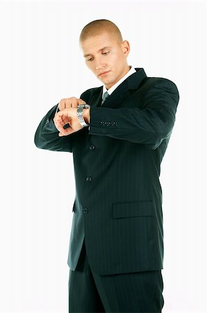 simsearch:400-03954954,k - A Young businessman looking at his hand watch Stock Photo - Budget Royalty-Free & Subscription, Code: 400-03954955