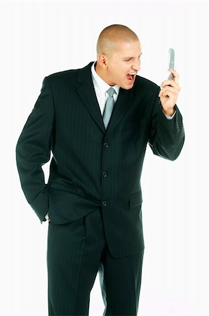 simsearch:400-03954954,k - A Young businessman using cell phone Stock Photo - Budget Royalty-Free & Subscription, Code: 400-03954957
