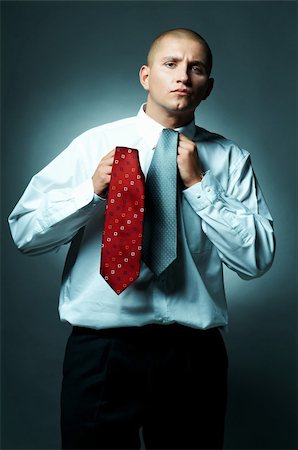 simsearch:400-03954954,k - A Young businessman choosing tie Stock Photo - Budget Royalty-Free & Subscription, Code: 400-03954976