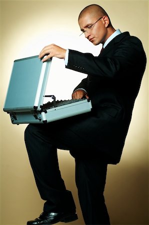 simsearch:400-03954954,k - A businessman holding open case Stock Photo - Budget Royalty-Free & Subscription, Code: 400-03955079
