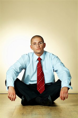 simsearch:400-03954954,k - A businessman is sitting on wooden floor Stock Photo - Budget Royalty-Free & Subscription, Code: 400-03955087