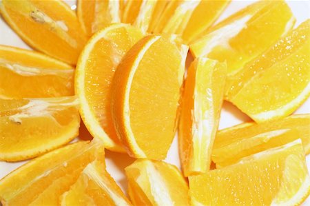 simsearch:400-04716078,k - fresh pieces of orange layed close-up on plate Stock Photo - Budget Royalty-Free & Subscription, Code: 400-03956709