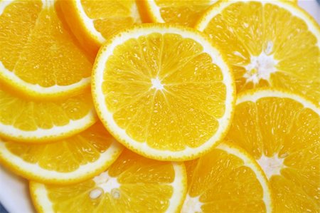 simsearch:400-04716078,k - fresh pieces of orange layed close-up on plate Stock Photo - Budget Royalty-Free & Subscription, Code: 400-03956718