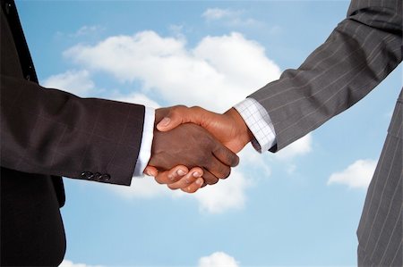 simsearch:400-04434336,k - This is an image of two male bodies, representing businessmen in a handshake of agreement. Cloud background to represent deal from "Heaven". Stock Photo - Budget Royalty-Free & Subscription, Code: 400-03956943