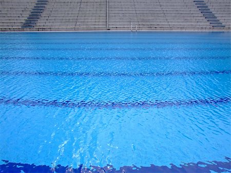 Trembling surface of an Olympic size swimming pool in empty sport arena Stock Photo - Budget Royalty-Free & Subscription, Code: 400-03957042