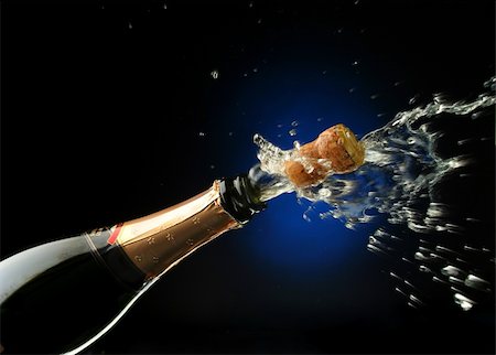 simsearch:825-05985931,k - Champagne splash. Bottle and cork, celebration time Stock Photo - Budget Royalty-Free & Subscription, Code: 400-03957639