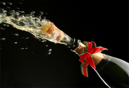 simsearch:825-05985931,k - Champagne splash. Bottle and cork, with christmas decoration Stock Photo - Budget Royalty-Free & Subscription, Code: 400-03957644