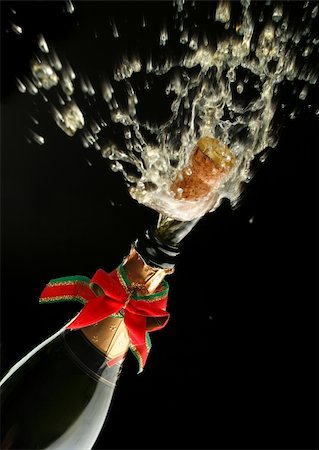 simsearch:400-05117424,k - Champagne splash. Bottle and cork, with christmas decoration Stock Photo - Budget Royalty-Free & Subscription, Code: 400-03957645