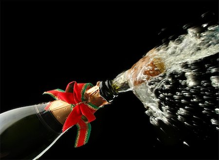 simsearch:400-05281659,k - Champagne splash. Bottle and cork, with christmas decoration Stock Photo - Budget Royalty-Free & Subscription, Code: 400-03957646