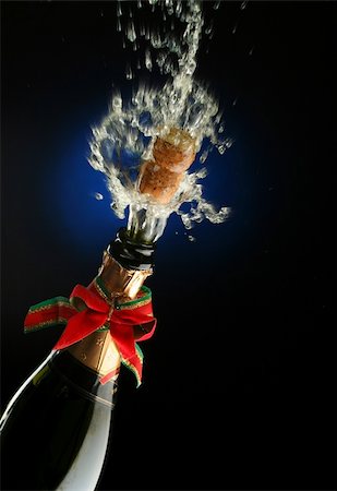 simsearch:825-05985931,k - Champagne splash. Bottle and cork, with christmas decoration Stock Photo - Budget Royalty-Free & Subscription, Code: 400-03957649