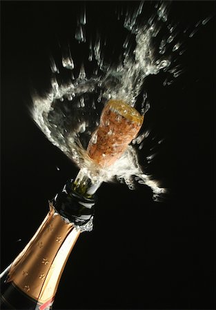 simsearch:825-05985931,k - Champagne splash. Bottle and cork, celebration time Stock Photo - Budget Royalty-Free & Subscription, Code: 400-03957641