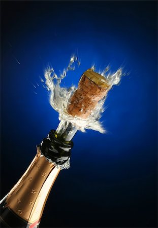 simsearch:825-05985931,k - Champagne splash. Bottle and cork, celebration time Stock Photo - Budget Royalty-Free & Subscription, Code: 400-03957642