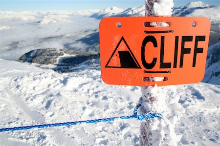 extreme skiing cliff - An orange sign warns of danger ahead. Stock Photo - Budget Royalty-Free & Subscription, Code: 400-03950102