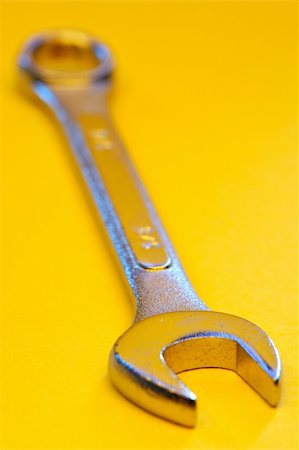 simsearch:400-03947919,k - Wrench tool on yellow Stock Photo - Budget Royalty-Free & Subscription, Code: 400-03950289