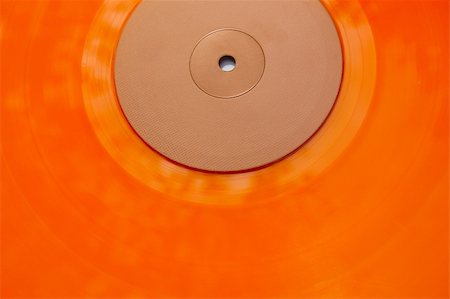 Colored orange vinyl record texture. Abstract background. Foto de stock - Super Valor sin royalties y Suscripción, Código: 400-03950966