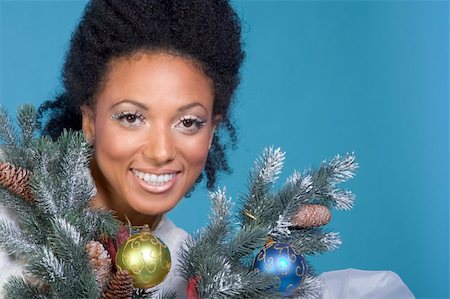 simsearch:632-06118429,k - Attractive female by decorated branches of Christmas tree Stock Photo - Budget Royalty-Free & Subscription, Code: 400-03951673