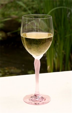 simsearch:649-07065069,k - Wine Glass with White Wine on Table Stock Photo - Budget Royalty-Free & Subscription, Code: 400-03952865