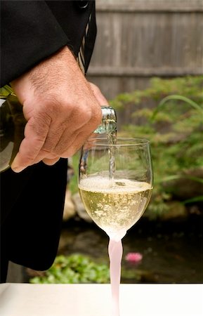 simsearch:400-04558755,k - Groom Pouring White Wine at a Wedding Stock Photo - Budget Royalty-Free & Subscription, Code: 400-03952860