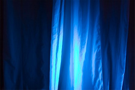 simsearch:632-05604064,k - Blue Spot Lights Against Stage Curtain Background Stock Photo - Budget Royalty-Free & Subscription, Code: 400-03952881