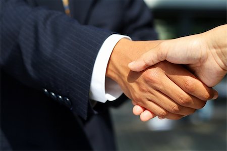 simsearch:400-04333648,k - Business man dressed in suit shaking hands with another person. Concept: Deal done or agreement made. Stock Photo - Budget Royalty-Free & Subscription, Code: 400-03953171