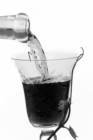 simsearch:400-04226436,k - Red wine pouring down from a wine bottle Stock Photo - Budget Royalty-Free & Subscription, Code: 400-03966430