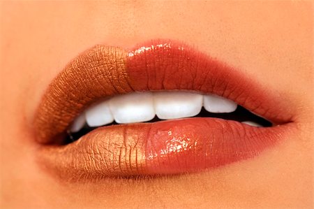 simsearch:400-04725812,k - Macro image of bright lips. Red and gold lipstik Stock Photo - Budget Royalty-Free & Subscription, Code: 400-03966463