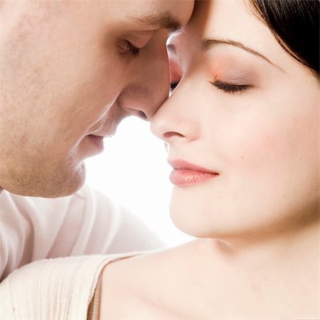 simsearch:632-01142541,k - Studio portrait of pretty young couple in love Stock Photo - Budget Royalty-Free & Subscription, Code: 400-03966835