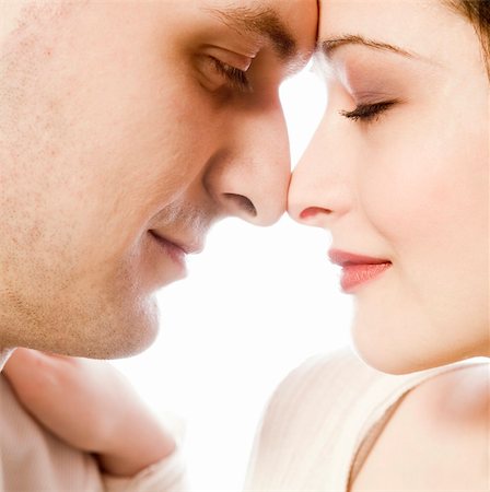 simsearch:632-01142541,k - Studio portrait of loving young couple Stock Photo - Budget Royalty-Free & Subscription, Code: 400-03966833