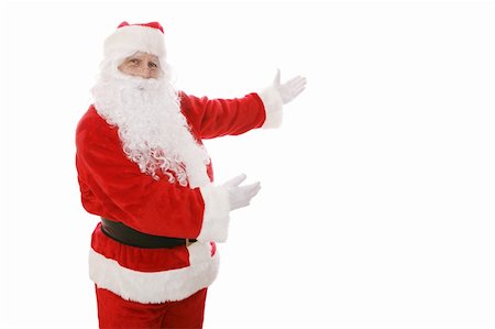 simsearch:693-06435898,k - Santa Claus gesturing toward an area of copy space.  Isolated design element. Stock Photo - Budget Royalty-Free & Subscription, Code: 400-03966859
