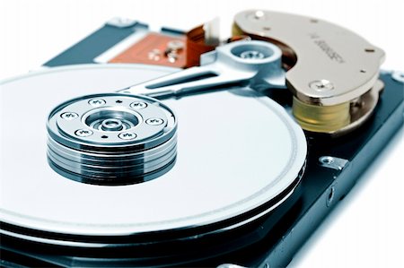 simsearch:400-05238336,k - Open hard disk drive - shallow depth of field with focus on the disk Stock Photo - Budget Royalty-Free & Subscription, Code: 400-03968287