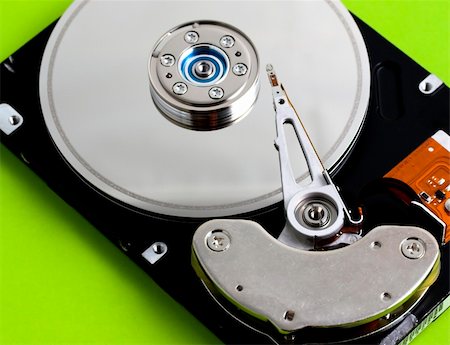 simsearch:400-05238336,k - Open hard disk drive in a green background Stock Photo - Budget Royalty-Free & Subscription, Code: 400-03968289