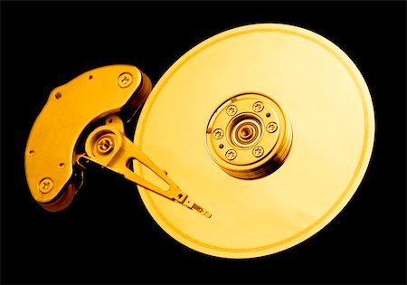 simsearch:400-05252692,k - Open hard disk drive, with a golden tone Stock Photo - Budget Royalty-Free & Subscription, Code: 400-03968296