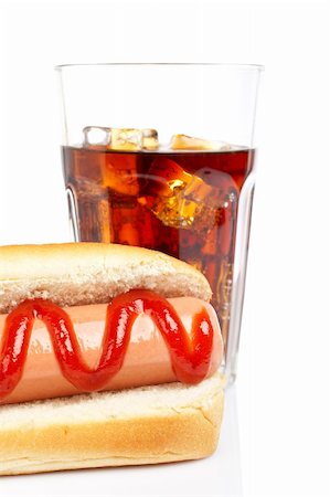 simsearch:400-04587885,k - A hot dog and soda glass, reflected on white background. Shallow DOF Stock Photo - Budget Royalty-Free & Subscription, Code: 400-03968330